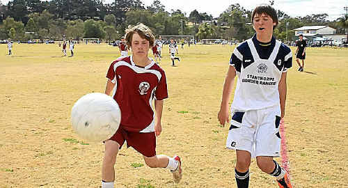 Warwick player Michael Washbourne and Stanthorpe player Alex Bell fight for the ball. Warwick player Michael Washbourne and Stanthorpe player Alex Bell fight for the ball.